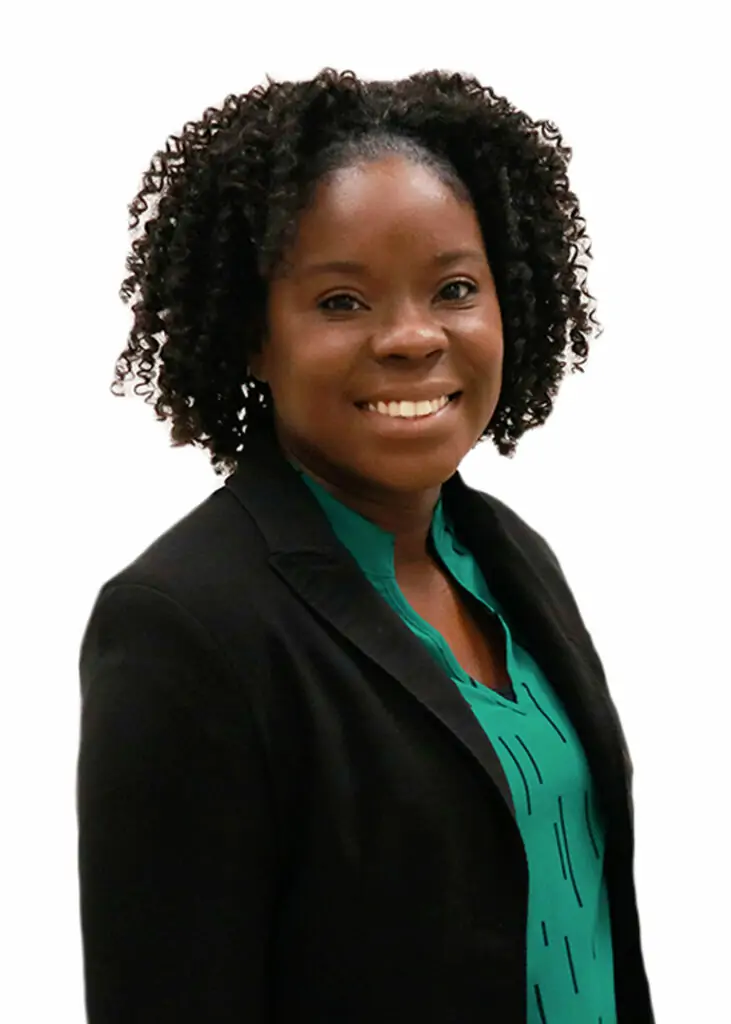 Woman smiling in green shirt staff photo