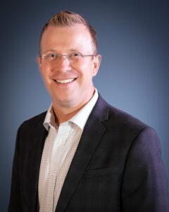 Stephen Herr - FLCOE Headshot Man smiling in blazer professional leadership headshot